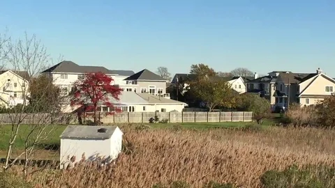 FALL SCENE - HOUSE WITH RED TREE AND REEDS (Monmouth Beach, NJ) Stock Footage