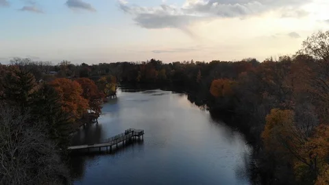 Fall Still Lake With Dock Overlooking Water Stock Footage 129769152