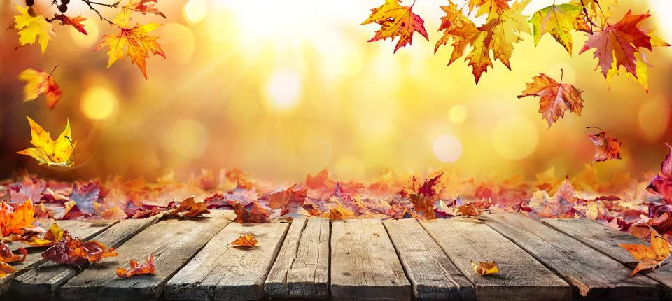 Fall Table - Autumn Leaves Falling On Wooden Plank Stock Photos