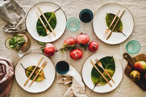 Fall table setting with fallen leaves for family gathering Stock Photos
