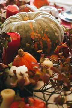 Fall thanksgiving decor with candle and pumpkins close up Stock Photos