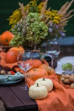 Fall themed holiday table setting arrangement for a seasonal party Stock Photos