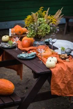 Fall themed holiday table setting arrangement for a seasonal party Stock Photos