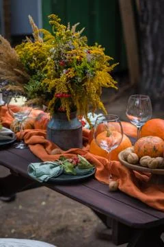 Fall themed holiday table setting arrangement for a seasonal party Stock Photos
