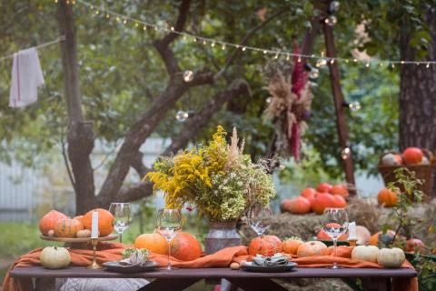 Fall themed holiday table setting arrangement for a seasonal party Stock Photos