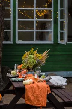 Fall themed holiday table setting arrangement for a seasonal party Stock Photos