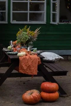 Fall themed holiday table setting arrangement for a seasonal party Stock Photos