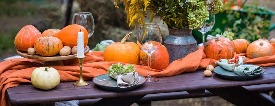 Fall themed holiday table setting arrangement for a seasonal party, banner Stock Photos