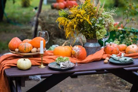 Fall themed holiday table setting arrangement for a seasonal party Stock Photos