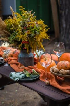Fall themed holiday table setting arrangement for a seasonal party Stock Photos