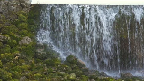 The fall of transparent drops of the waterfall to the ground 库存影片 126637540