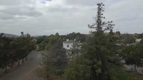 Fall Trees Reveal Old Mansion Video stock 236488755