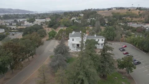 Fall Trees Reveal Old Mansion Video stock 236490129