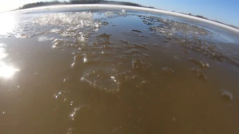 The Fall under the ice. Thin spring ice. Stock Footage 105779147