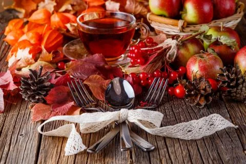 Fall wealth on rustic wooden background with fork and spoon Foto stock