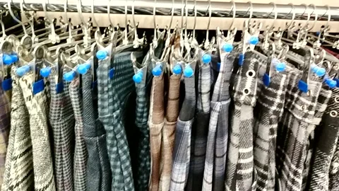Fall winter trend plaid tweed and neutrals on rack camera movement content for c Stock Footage 320407636