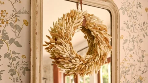 Fall Wreath Hanging on Mirror in Warm Staged Interior Stock Footage 340402215