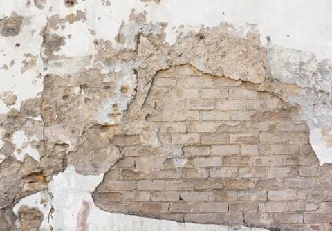 Falled plaster on brick wall Stock Photos