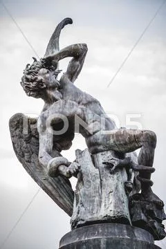 Fallen angel, devil figure, bronze sculpture with demonic gargoyles and ...