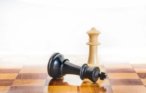 Fallen chess king as a metaphor for fall from power Stock Photos