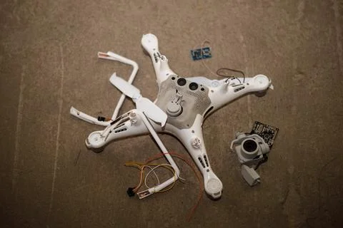 Fallen damaged quadcopter drone crash on a floor Stock Photos