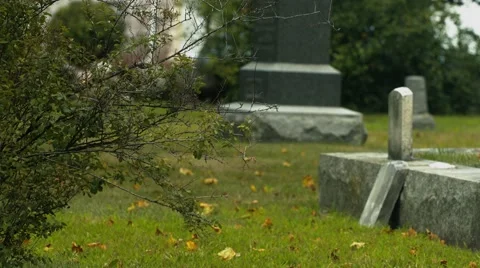 Fallen Headstone in Cemetery Stock Footage 40909124