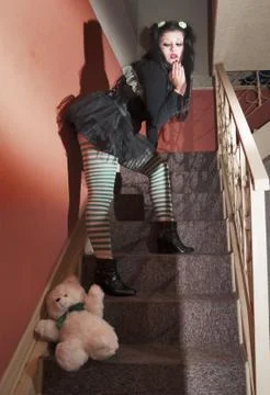 Fallen stuffed bear and human doll Stock Photos