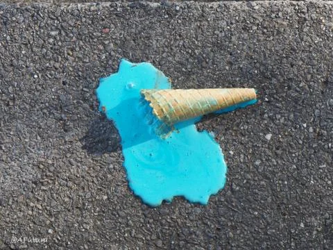 Fallen waffle squirrel with turquoise ice cream Stock Photos