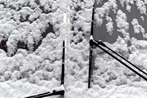 Fallen white snow on windshield of the bus Stock Photos