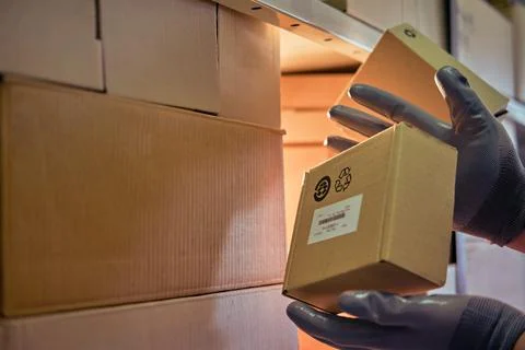 Falling and damage to packaging and goods in parcels in the warehouse. Proble Stock Photos
