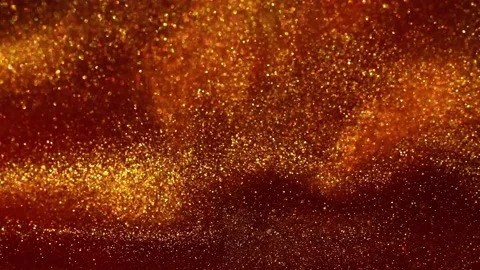 Falling and mixing Gold Particles in Red Liquid. Video stock 240043912