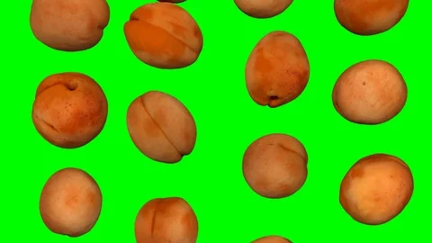 Falling Apricots on Green Background (Looping) Stock Footage 92932389