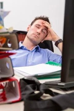 Falling  asleep at office Stock-Fotos