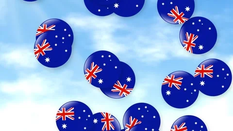Falling Australian Flag Patterned Spheres Against a Cloudy Blue Sky Stock Footage 341461734