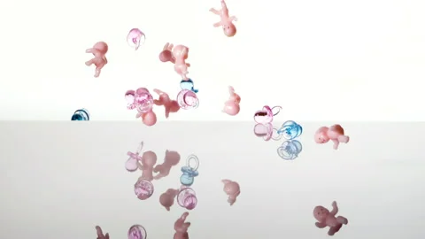 Falling babies and dummies pouring, white background. Baby shower and population 스톡 동영상 163724846