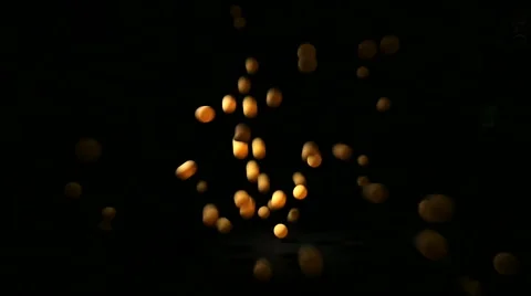 Falling balls against black background NTSC Stock Footage 40795085
