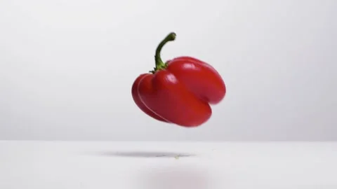 Falling a bell pepper on the ground Stock Footage 132861386