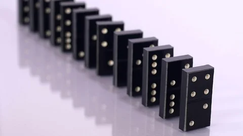 Falling black dominoes in slow motion Stock Footage 70210791