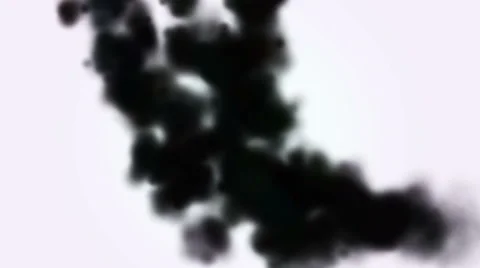 Falling black ink into water on a white background Stock Footage 64730710