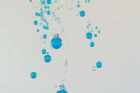 Falling blue bubbles Stock Photos