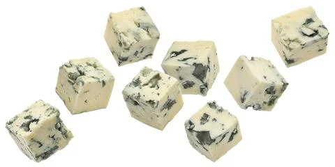 Falling blue cheese cubes isolated on white background, full depth of field Foto stock