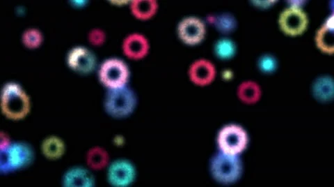 Falling Blur Colored Circles Particles on Black Background Stock Footage 62410511