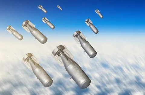 Falling bombs weapons charges dropped from a fighter combat aircraft high in  Foto stock
