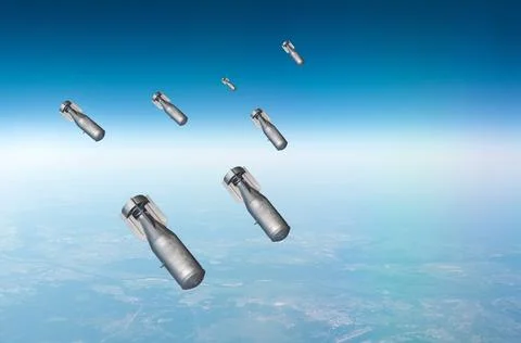 Falling bombs weapons charges dropped from a fighter combat aircraft high in  Fotos Stock