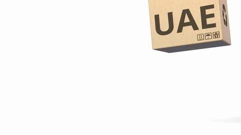 Falling boxes with PRODUCT OF UAE text. ... | Stock Video | Pond5