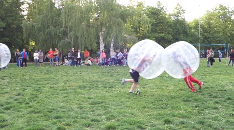Falling boys in the difficult game zorb Stock Footage 68663469