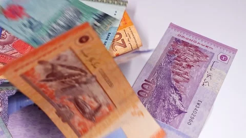 Falling brand new Malaysian ringgit (MYR) banknotes. Selective focus. Stock Footage 300028088