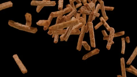 Falling breadcrumbs on a black background. Snack to beer. Close up. Slow motion Stock Footage 135468575