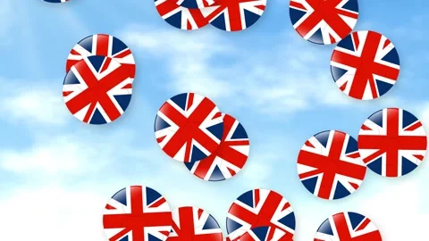 Falling British Flag Patterned Footballs Against a Bright Cloudy Sky Vídeo Stock 340195515