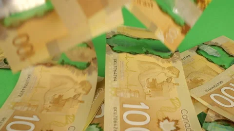 Falling Canadian 100 dollar polymer banknotes with a portrait of Robert Borden Stock Footage 231506734